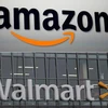 Biểu tượng Amazon và Walmart. (Nguồn: AFP/TTXVN)