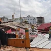 Hiện trường vụ sập nhà ở Preah Sihanouk, Campuchia. (Nguồn: THX/TTXVN)