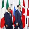 Lễ đón Thủ tướng Nguyễn Xuân Phúc dự Hội nghị cấp cao Nhóm các nền kinh tế phát triển và mới nổi hàng đầu thế giới (G20). (Ảnh: Thống Nhất/TTXVN)