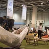 Một phóng viên đang nằm nghỉ trên chiếc võng được ban tổ chức bố trí tại Trung tâm báo chí, Hội nghị Thượng đỉnh G20, Osaka, Nhật Bản.