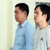 Hai bị cao Bùi Đức Nghĩa và Nguyễn Tuấn Anh tại tòa. (Ảnh: TTXVN phát)