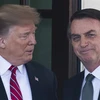 Tổng thống Mỹ Donald Trump (trái) trong cuộc gặp người đồng cấp Brazil Jair Bolsonaro đang ở thăm Nhà Trắng ngày 19/3. (Ảnh: AFP/TTXVN)