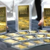 Vàng miếng được trưng bày tại sàn giao dịch ở Seoul, Hàn Quốc. (Ảnh: Yonhap/TTXVN)
