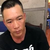 Đối tượng Phạm Hồng Phong bị bắt giữ tại cơ quan điều tra. (Ảnh: TTXVN phát)