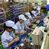 Hoạt động sản xuất tại Công ty TNHH Công nghiệp Minda Việt Nam (khu công nghiệp Bình Xuyên). (Ảnh: Hoàng Hùng/TTXVN)