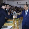 Thủ tướng Nguyễn Xuân Phúc dự Hội nghị toàn quốc tổng kết 10 năm Chương trình mục tiêu quốc gia xây dựng nông thôn mới. (Ảnh: Thống Nhất/TTXVN)