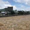 Mưa lớn khiến mực nước sông Cái qua thành phố Nha Trang dâng cao. (Ảnh: Phan Sáu/TTXVN)