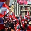 Người biểu tình phản đối Chính phủ tuần hành tại Tripoli, Liban. (Ảnh: THX/TTXVN)