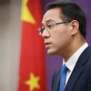 Người phát ngôn Bộ Thương mại Trung Quốc Cao Phong trong một cuộc họp báo tại Bắc Kinh. (Ảnh: AFP/TTXVN)