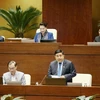 Bộ trưởng Bộ Kế hoạch và Đầu Tư Nguyễn Chí Dũng giải trình làm rõ vấn đề đại biểu Quốc hội nêu. (Ảnh: Phương Hoa/TTXVN)