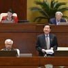 Bộ trưởng Bộ Nội vụ Lê Vĩnh Tân giải trình ý kiến của Đại biểu Quốc hội. (Ảnh: Dương Giang/TTXVN)