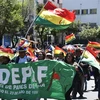 Người dân tham gia cuộc tuần hành ủng hộ Tổng thống Bolivia Evo Morales tại La Paz. (Ảnh: AFP/TTXVN)