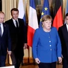 (Từ trái sang) Tổng thống Nga Vladimir Putin, Tổng thống Pháp Emmanuel Macron, Thủ tướng Đức Angela Merkel và Tổng thống Ukraine Volodymyr Zelensky tới Hội nghị thượng đỉnh nhóm Bộ tứ Normandy ở Paris (Pháp). (Ảnh: AFP/TTXVN)