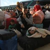 Người tị nạn Syria trở về từ Liban. (Ảnh: THX/TTXVN)