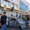Hiện trường một vụ nổ bom ở quảng trường Tahrir, thủ đô Baghdad, Iraq. (Ảnh: AFP/TTXVN)