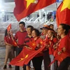 Cổ động viên đến sân cổ vũ U23 Việt Nam. (Ảnh: Nguyên An/Vietnam+)