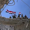 Binh sỹ Chính phủ Syria giành quyền kiểm soát một thành phố thuộc tỉnh Quneitra từ lực lượng nổi dậy. (Ảnh: AFP/TTXVN)