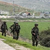 Binh sỹ Israel tuần tra gần trạm kiểm soát al-Hamra ở Thung lũng Jordan, Bờ Tây. (Ảnh: AFP/TTXVN)
