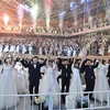 Các cặp đôi tham gia đám cưới tập thể tại Trung tâm Peace World Cheong Shim ở quận Gapyeong, Tây Bắc Seoul. (Ảnh: AFP/TTXVN)