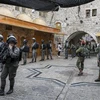 Lực lượng an ninh Israel tuần tra tại thành phố Hebron, Bờ Tây. (Ảnh: AFP/TTXVN)