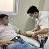 Người tham gia hiến máu trong mùa dịch COVID-19. (Ảnh: Mai Trang/TTXVN)