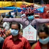 Người dân đeo khẩu trang để phòng chống dịch COVID-19 tại Channai, Ấn Độ. (Nguồn: AFP)