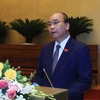 Thủ tướng Chính phủ Nguyễn Xuân Phúc trình bày Báo cáo về phòng, chống dịch Covid-19 và những nhiệm vụ, giải pháp trọng tâm phục hồi, phát triển kinh tế-xã hội. (Ảnh: Thống Nhất/TTXVN)