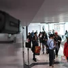 Hành khách tại sân bay quốc tế Phnom Penh, Campuchia. (Ảnh: AFP/TTXVN)