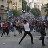Người biểu tình đụng độ với cảnh sát tại thủ đô Beirut. (Nguồn: EPA)