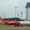 Máy bay của VietjetAir tại sân bay quốc tế Tân Sơn Nhất (TP Hồ Chí Minh). (Ảnh: Ngọc Hà/TTXVN)