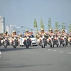 Các nữ chiến sỹ Cảnh sát giao thông triển khai đội hình. (Ảnh: Thành Chung/TTXVN)