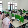 Kỹ sư công nghệ thông tin làm việc tại Công viên phần mềm Mekong. (Ảnh: Minh Hưng/TTXVN)