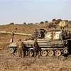 Binh sỹ Israel tham gia một cuộc diễn tập quân sự tại Cao nguyên Golan, gần Merom Golan trên biên giới với Syria. (Ảnh: AFP/TTXVN)