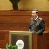 Bộ trưởng Bộ Công an Tô Lâm thừa ủy quyền của Thủ tướng Chính phủ trình bày Tờ trình về dự án Luật Lực lượng tham gia bảo vệ an ninh, trật tự ở cơ sở. (Ảnh: Dương Giang/TTXVN)