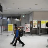 Hành khách tới khu vực kiểm dịch tại sân bay Narita, Nhật Bản. (Ảnh: AFP/TTXVN)