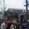 Nhà cửa bị phá hủy sau vụ phóng rocket và nã pháo của các lực lượng Armenia tại Ganja, Azerbaijan. (Ảnh: AFP/TTXVN)
