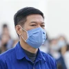 Bị cáo Nguyễn Nhật Cảm nghe Tòa tuyên án. (Ảnh: Doãn Tấn/TTXVN)