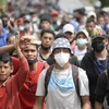 Người di cư Honduras di chuyển tại Camotan, Guatemala trong hành trình tới Mỹ. (Ảnh: AFP/TTXVN)