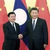 Chủ tịch nước Trung Quốc Tập Cận Bình (phải) và Tổng Bí thư Ban chấp hành trung ương Đảng Nhân dân Cách mạng Lào Thongloun Sisoulith. (Nguồn: fmprc.gov.cn)