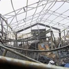 Cảnh tàn phá sau vụ tấn công bằng rocket nhằm vào một căn cứ quân sự ở sân bay Arbil, Iraq, ngày 17/2. (Ảnh: AFP/TTXVN)