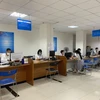 Cục Thuế thành phố Hà Nội thông tin người dân nên khai thuế qua kênh trực tuyến. (Ảnh: CTV/Vietnam+)