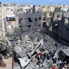 Hiện trường đổ nát sau vụ không kích của Israel xuống thành phố Khan Younis, Dải Gaza, ngày 19/5. (Ảnh: THX/TTXVN)