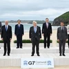 Các đại biểu chụp ảnh chung tại Hội nghị thượng đỉnh G7 ở Cornwall (Anh). (Ảnh: AFP/TTXVN)