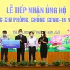 Các doanh nghiệp ủng hộ Quỹ vaccine phòng, chống COVID-19 Việt Nam. (Ảnh: Hoàng Hiếu/TTXVN)