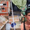 Đối tượng Xêng Phêng Say và tang vật 38.000 viên ma túy tổng hợp bị bắt khi đang vận chuyển qua biên giới. (Nguồn: bienphong.com.vn)