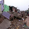 Nhà cửa bị phá hủy do mưa lũ tại khu vực Kashmir thuộc kiểm soát của Ấn Độ. (Ảnh: AFP/TTXVN)