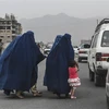 Phụ nữ và trẻ em tại thủ đô Kabul, Afghanistan. (Ảnh: AFP/TTXVN)