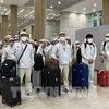 Lao động Việt Nam nhập cảnh tại sân bay Incheon (Hàn Quốc). (Ảnh: Anh Nguyên/TTXVN)