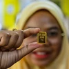 Vàng miếng được trưng bày tại Kota Bharu, bang Kelantan, Malaysia. (Ảnh: AFP/TTXVN)