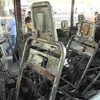 Một chiếc xe buýt chở các quân nhân Syria bị phá hủy trong vụ đánh bom ở Damascus, ngày 20/10/2021. (Ảnh: AFP/TTXVN)